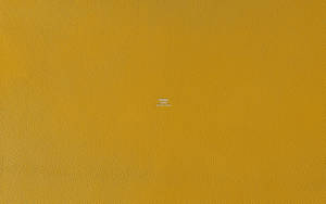 Mustard Yellow Textured Hermes Wallpaper