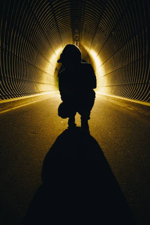 Mysterious Boy Shadow In Dark Tunnel Wallpaper