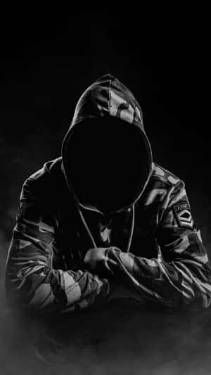 Mysterious_ Figure_in_ Camouflage_ Hoodie.jpg Wallpaper