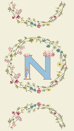 N Inside A Floral Wreath Wallpaper