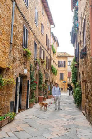 Narrow Alley With Brick Houses Pienza Italy Wallpaper