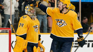 Nashville Predators' Ryan Johansen And Juuse Saros On Ice. Wallpaper