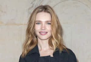 Natalia Vodianova Posing Elegantly In A Classic Black Dress Wallpaper