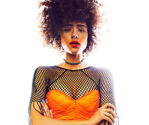 Nathalie Emmanuel Fashion Orange Outfit Wallpaper