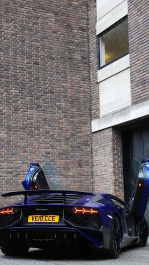 Neon Blue Lamborghini Urban Backdrop Wallpaper