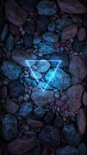 Neon_ Triangle_ Among_ Rocks.jpg Wallpaper