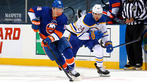 New York Islanders In Action Against The Sabres Wallpaper