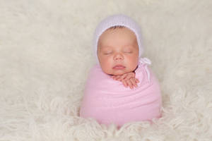 Newborn Baby Pink Bonnet Wallpaper