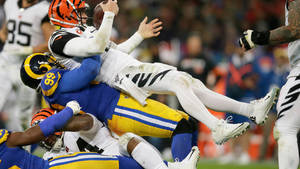 Nfl Football Aaron Donald Chaotic Fall Down Scene Wallpaper