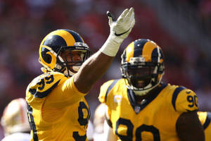 Nfl Match Aaron Donald Yellow Jersey Wallpaper