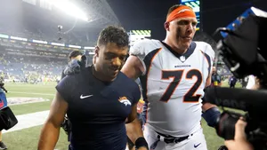 Nfl Stars In Action - Russell Wilson And Garett Bolles Wallpaper