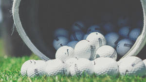 Nike Golf Balls On Grass Wallpaper