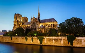 Notre Dame Cathedral With Golden Light Wallpaper