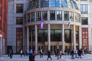 Nyu Business Students Walking On Campus Wallpaper