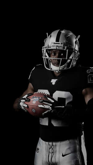 Oakland Raiders Holding Ball Wallpaper