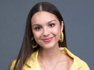 Olivia Rodrigo Yellow Dress Smile Wallpaper