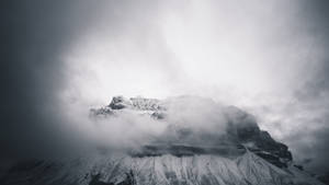 Ominous And Foggy Elevated Landscape Wallpaper