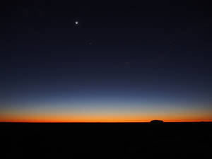 Ominous Moon In The Horizon Wallpaper