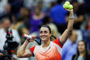 Ons Jabeur, A Tunisian Professional Tennis Player, Holding Three Tennis Balls In The Court. Wallpaper