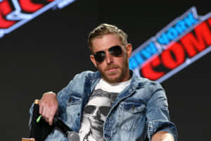 Orange Cassidy At Ny Comic-con In His Signature Sunglasses Wallpaper