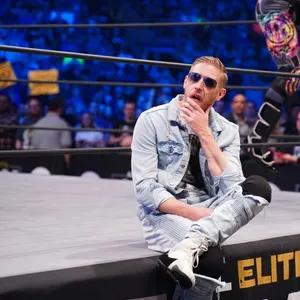 Orange Cassidy Sitting Onstage Wallpaper