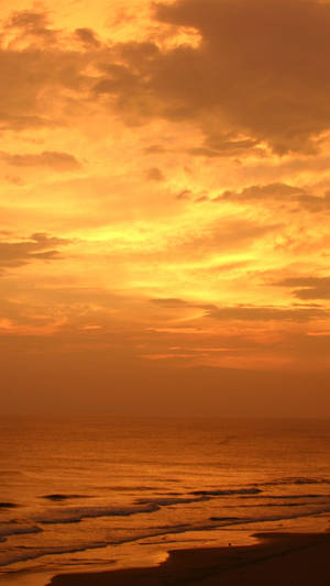 Orange Dusk At The Beach Wallpaper