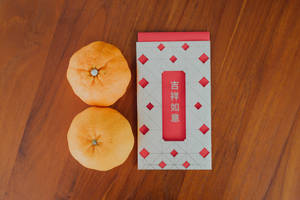 Orange Fruit On Red And White Checkered Table Wallpaper