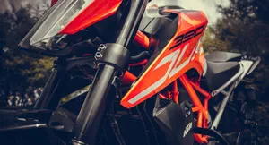Orange Ktm Duke 390 Side Angle Shot Wallpaper