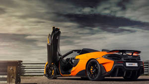 Orange Mclaren Spyder On Mountain Wallpaper