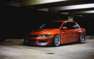 Orange Shiny Mitsubishi Evolution Wallpaper