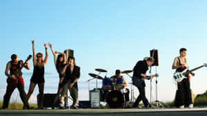 Outdoor Rock Band Performance Wallpaper