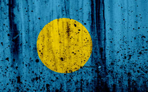 Palau Flag With Black Paint Wallpaper