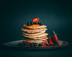 Pancakes With Strawberries And Blueberries On Top Wallpaper