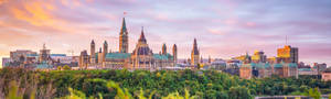 Panoramic View Of Parliament Hill In Ottawa Wallpaper