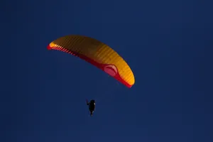 Paragliding Under Night Sky Wallpaper