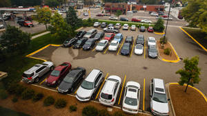 Parking Space With Bushes And Trees Wallpaper