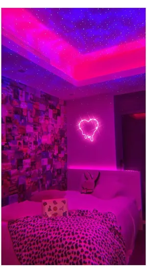 Pastel Pink Fairy Lights Illuminate A Dim Room. Wallpaper