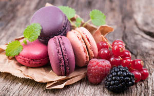 Pastel Pink Macarons With Berries Wallpaper