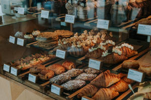 Pastries In Glass Display Wallpaper