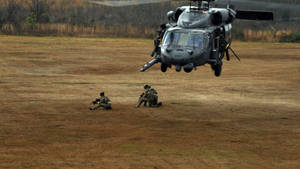 Pave Hawk Military Helicopter Offloading Troops Wallpaper