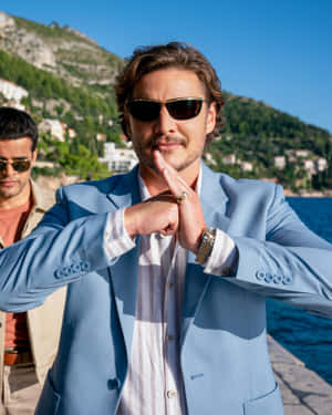 Pedro_ Pascal_ Stylish_ Oceanside_ Pose Wallpaper