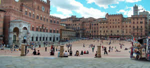 People At Piazza Del Campo In Siena Wallpaper