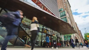 People Walking In Front Of The New School Wallpaper