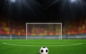 Perspective Of Soccer Ball In Football Field Wallpaper