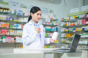 Pharmacist Arm On Her Chest Wallpaper