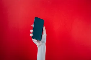 Phone With Red Color Background Wallpaper