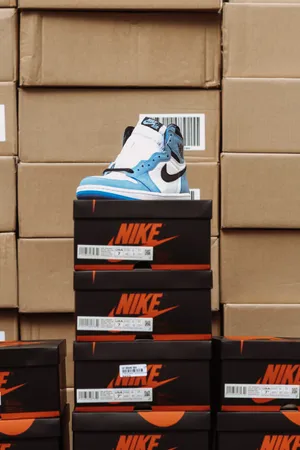 _photo A White Shoe Box With The Company's Logo, Perfect For Keeping Your Shoes Organized!_ Wallpaper