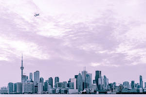 Photography Of City Scape Under Plane At Daytime Wallpaper