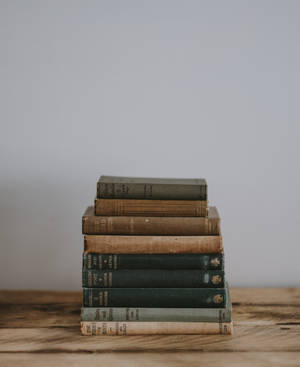 Pile Of Bible On Brown Surface Wallpaper