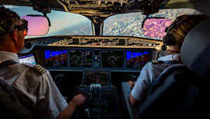 Pilot Co-pilot Cockpit Flying In The Air Wallpaper